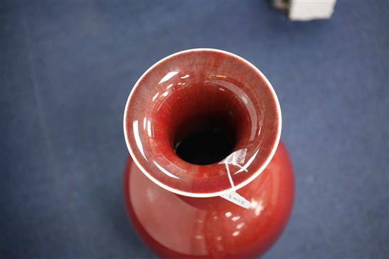 A large Chinese sang de boeuf glazed baluster vase, early 20th century, 50.5cm, wood stand, base drilled